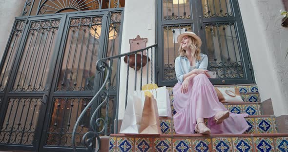 Beautiful Traveler Is Enjoying Shopping Day on Colorful Stairs in Old Town, 