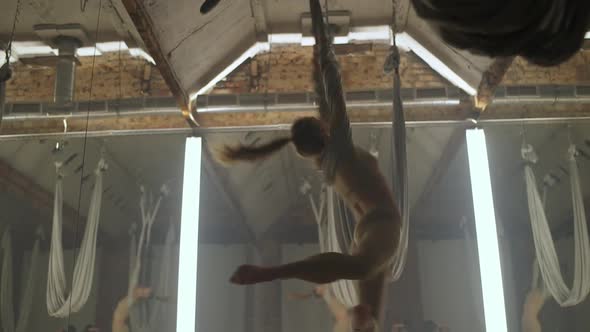 Young Female Doing Yoga in a Mirror Room Flexible Woman Performs a Beautiful Dance with Yoga