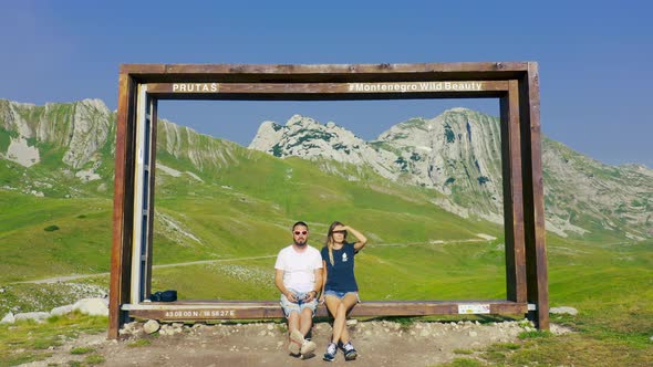 Beautiful Couple Sit in Mountain Prutas at National Park Durmitor Montenegro