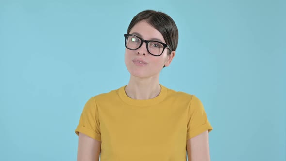 Optimistic Young Woman Looking at Camera and Smiling on Purple Background