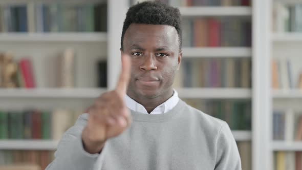 Portrait of African Man Showing No Sign By Finger Denial