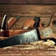 A Saw Falls on a Table with Sawdust - VideoHive Item for Sale