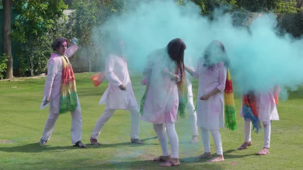 Indian people throwing colors at each other