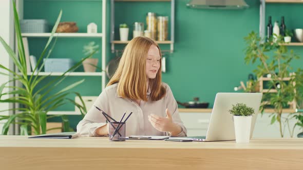 Joyful Red Haired Teenage Girl Studying Online Comfortable Home Teaching Online