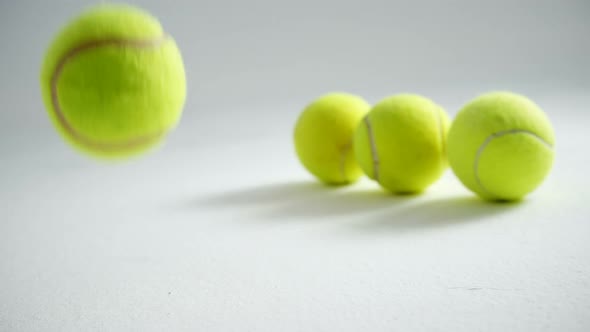 Tennis balls arranged on white background