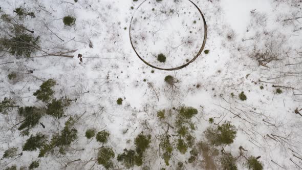 Top down aerial view flying over Katahdin Ironworks Winter in Maine