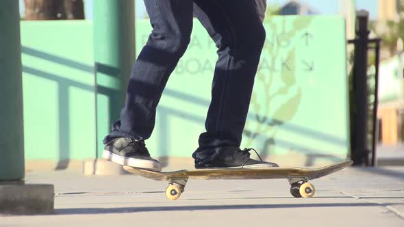 A young man skateboarding.