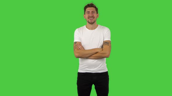 Confident Guy Is Listening Attentively, Nodding His Head and Laughing. Green Screen