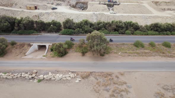 Aerial drone shot of coastline highway traffic along the mountain road. Tourism concept