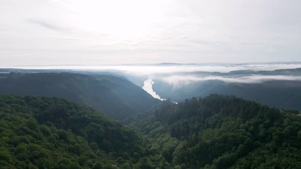 The lush, picturesque moselle valley on a bright cloudy morning. Cinematic wide angle pull back shot