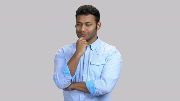 Thoughtful Cunning Darkskinned Man Touching His Chin