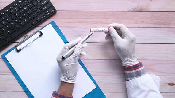 Laboratory Technician Hand Holding Blood Test Tube 