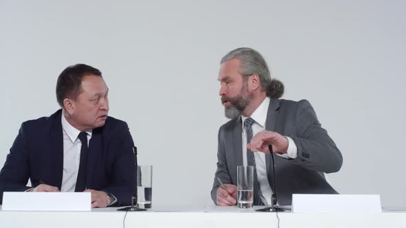 Two Multiethnic Politicians in Conference Hall