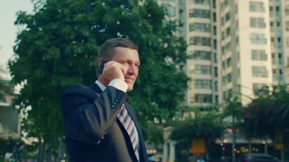 A Man Talking on a Cell Phone in the Street