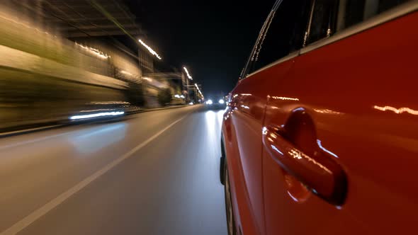 Drivelapse From Side of Car Moving on a Night Avenue in City Timelapse Hyperlapse