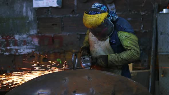 Worker polishing in metal industry