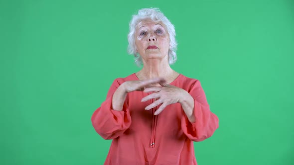 Portrait Elderly Woman Looking at the Camera Clapping Her Hands with Wow Happy Joy and Delight