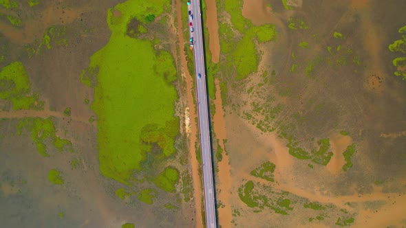 Drone video of the road leads through a large beautiful wetland.