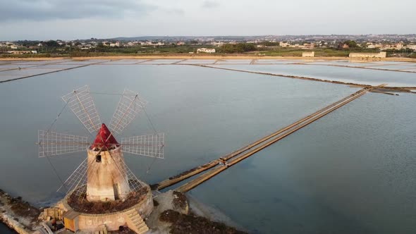 Windmill And Saline Near The  Town Mazara del Vallo In The Province Of Trapani, Southwestern Sicily,