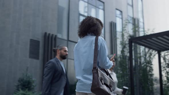 Focused Woman Using Tablet Computer Browsing in Downtown