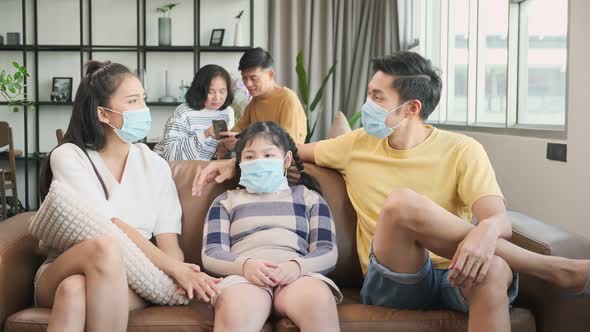 asian family multi generation wearing surgical facial mask together