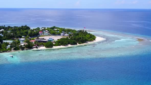 Aerial drone seascape of island beach trip by ocean with sand background