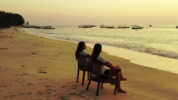 Beautiful women look beautiful on exotic shore beach wildlife by shallow lagoon with white sandy bac