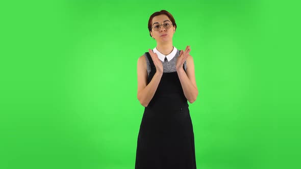 Funny Girl in Round Glasses Is Clapping Her Hands Indifferent, Green Screen