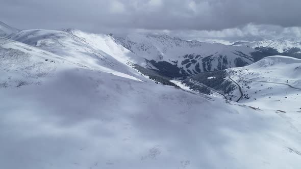 Storm brewing over the peaks on Loveland Pass, Colorado. Aerial views of mountains and highway 6.