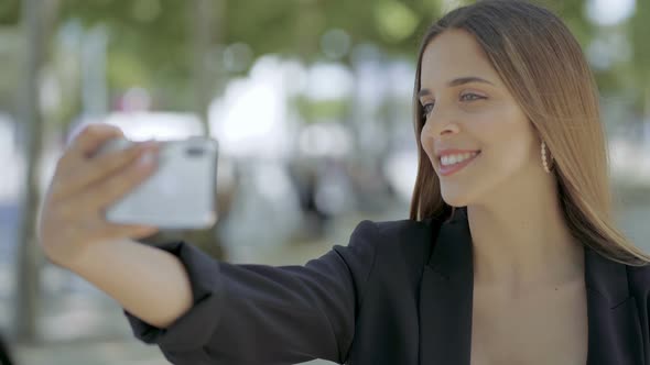 Happy Girl Taking Selfie with Smartphone