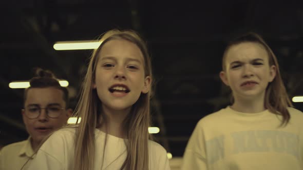 Angry Bullies Threaten Classmate Shouting in Corridor Closeup