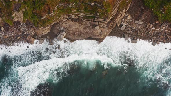 Aerial View of the Picturesque High Coastline Sharp Cliffs and Raging Sea