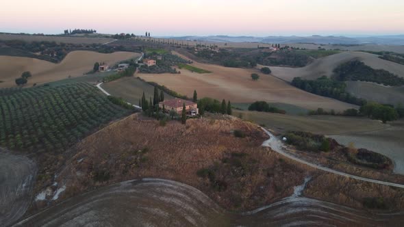 Val d'Orcia Farmhouse and Rolling Hills in Tuscany Aerial View