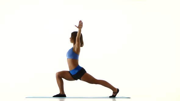 Gymnast Doing Stretching and Turning Torso. White