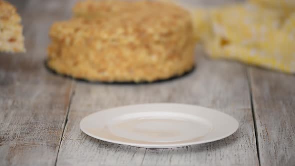 Slice of Sweet Classic Layered Cake Napoleon on a White Plate