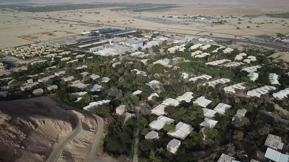 Aerial: top view of the small village of Yotvata in the middle of the desert, Israel