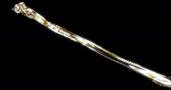 Jet of Dark Beer on a Black Background alt