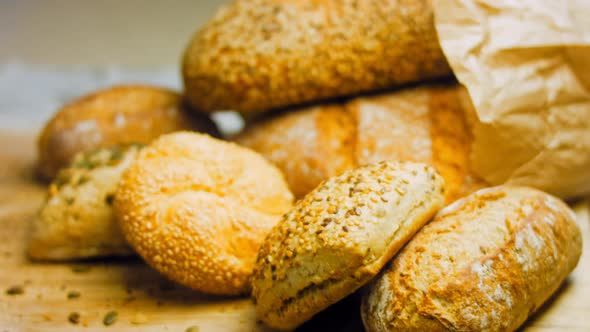 Different Kinds of Fresh Bread on Wooden Table