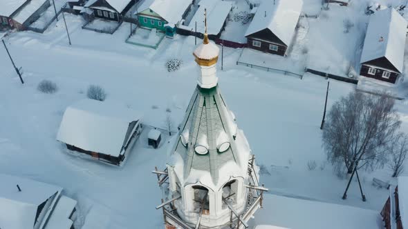 Aerial View of the Church in the Village in Winter