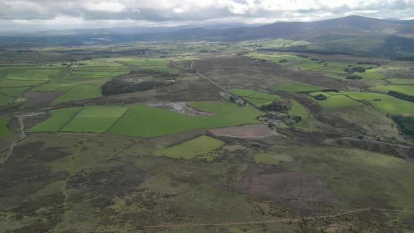 Aerial view across rural mountain terrain