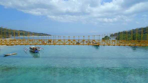 Vehicles Using The Yellow Bridge Connecting Nusa Lembongan and Cennigan Islands