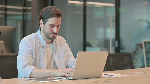 Thumbs Up By Man with Laptop