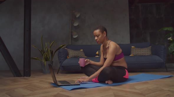 Sporty Fit Woman Working on Laptop After Training