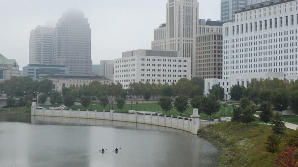 Kayaking in downtown Columbus, Ohio on the Scioto River on a misty day.