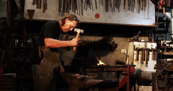 Blacksmith working on a iron rod