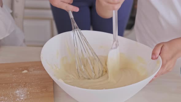 Close-up of Childs with Mom Preparing Dough in Kitchen at Home. , UHD