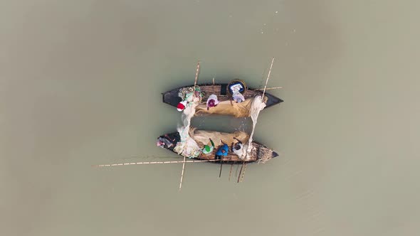 Aerial view of traditional canoe used for fishing in Bengali river, Bangladesh.