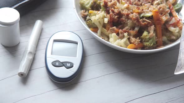 Diabetic Measurement Tools and Healthy Food on Table