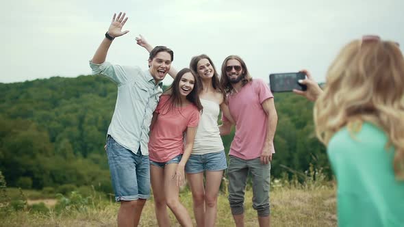 Happy Friends Taking Photos On Phone In Nature.