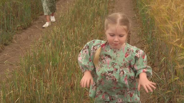 Little Girl Jumping in the Field